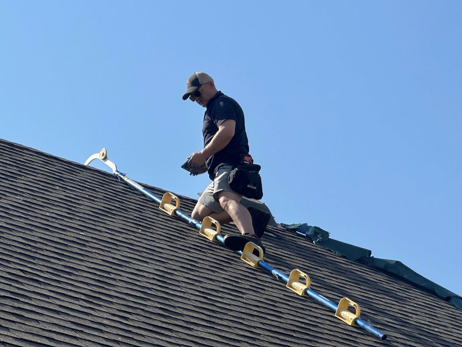 Greg Cannon of Coppermark inspecting a roof for storm damage in Oklahoma