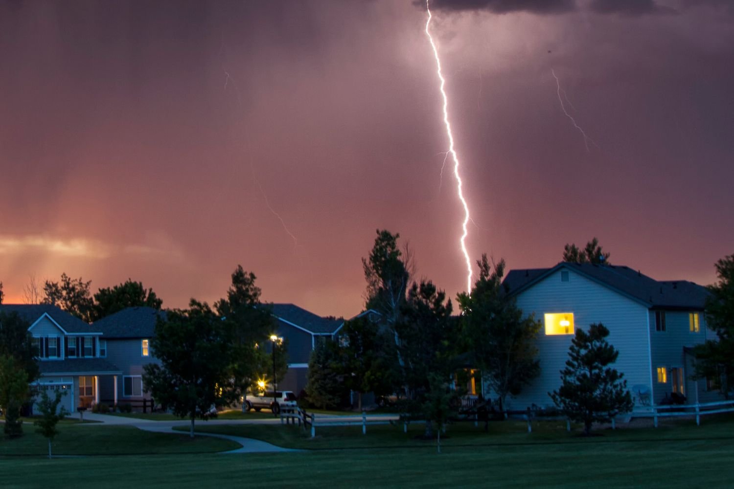 Adjuster inspecting lightning and power-surge damage in a home